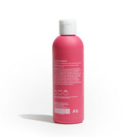 Olio massaggi Milo Dafne, flacone visto dal retro con etichetta ingredienti su sfondo bianco