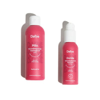 Essential kit Dafne con olio massaggio Milo e lubrificante Doride su sfondo bianco